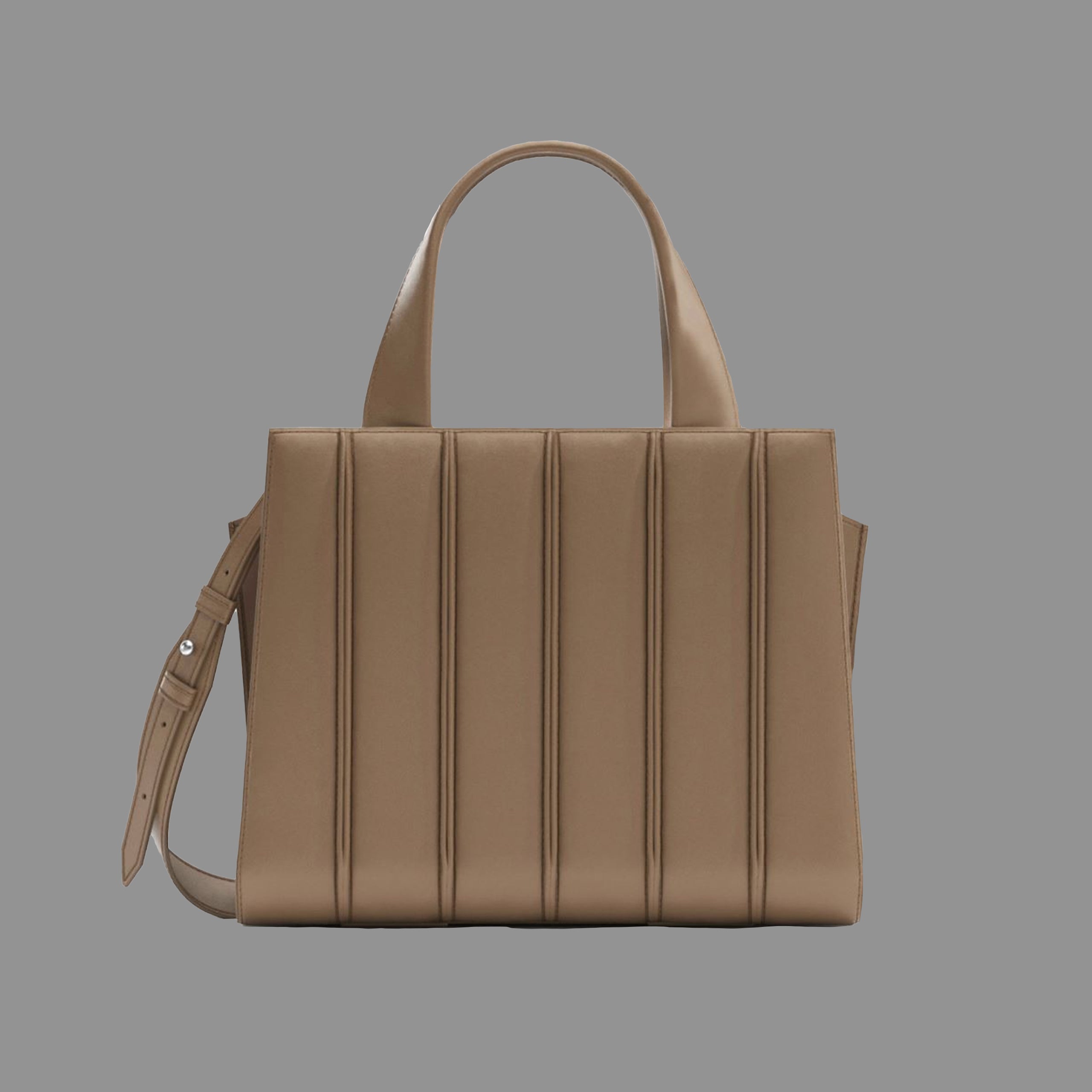 Camel handbag with a shoulder strap on a gray background