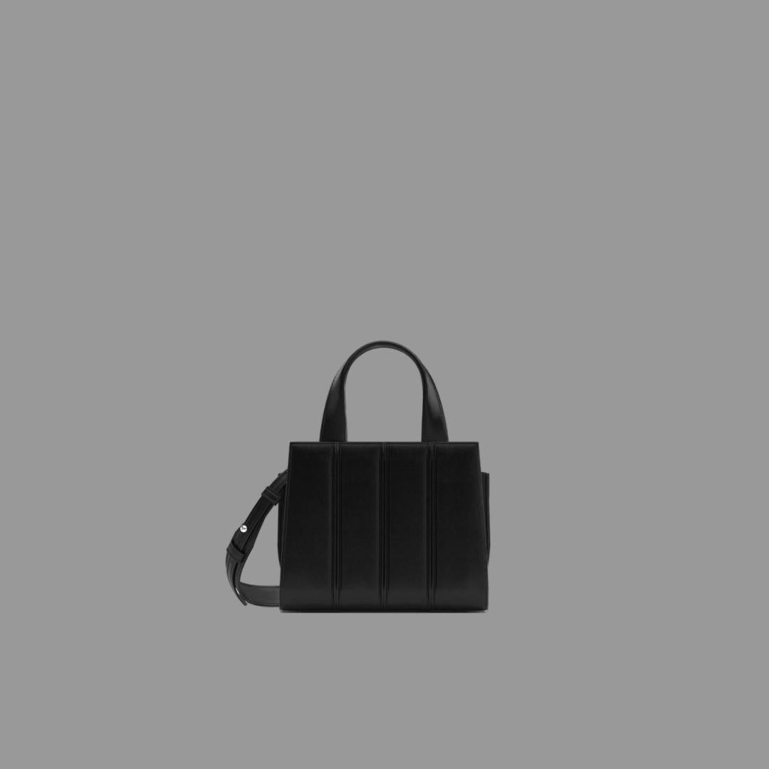 Black handbag on a gray background