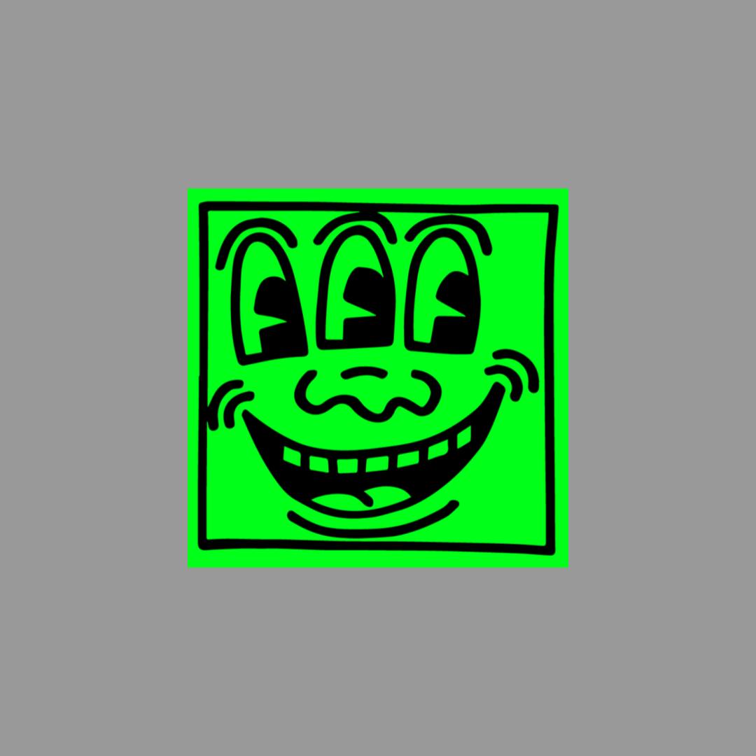 Green sticker from Keith Haring featuring three faces and a grin