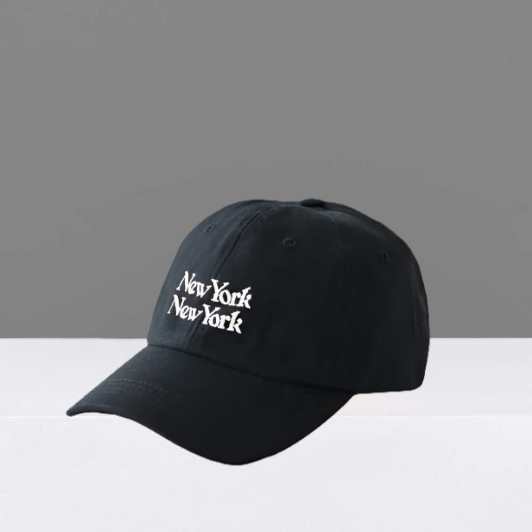 Black cap with 'New York New York' text on a gray and white background