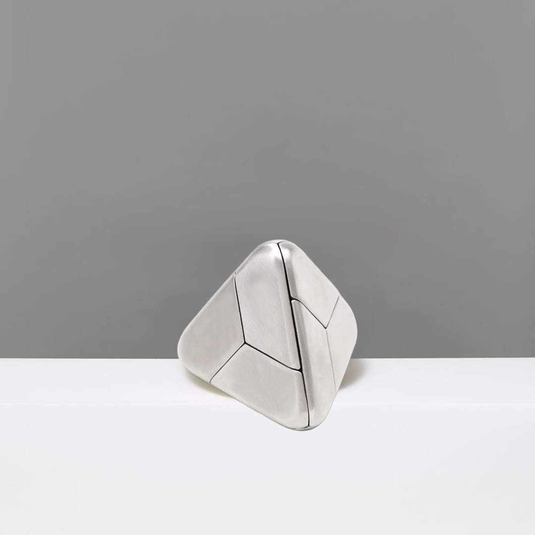 Triangular silver geometric puzzle on a gray background