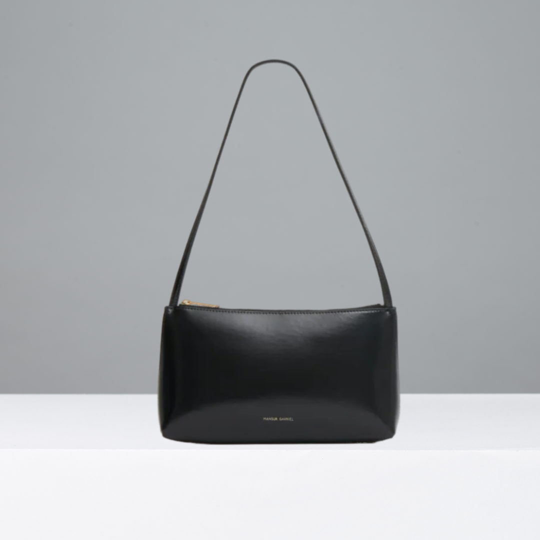 Black handbag on a gray background