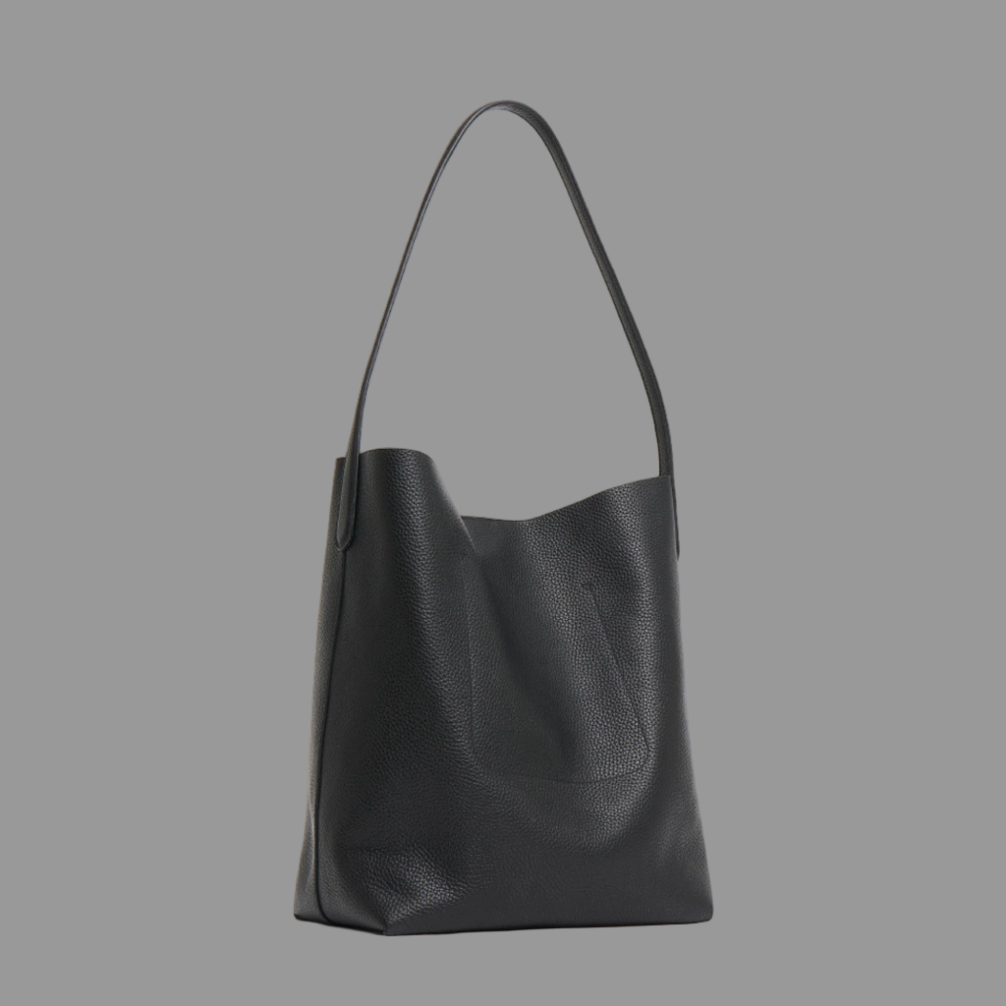 Black leather handbag on a light gray background