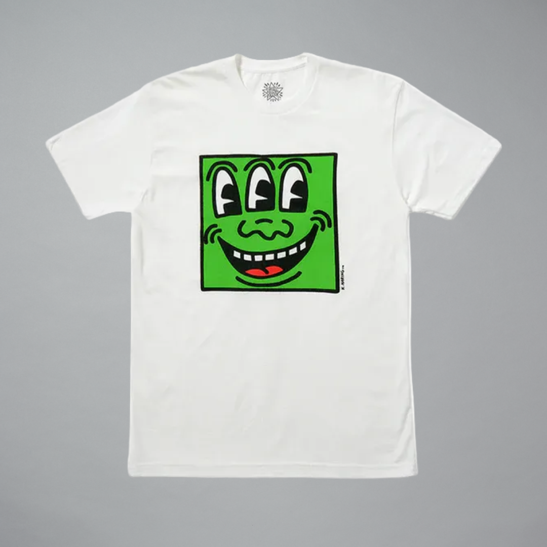 White t-shirt with a green square face graphic on a gray background