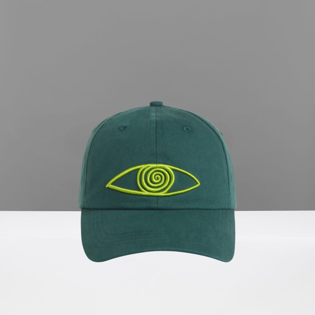 Green cap with a green spiral eye design on a gray background
