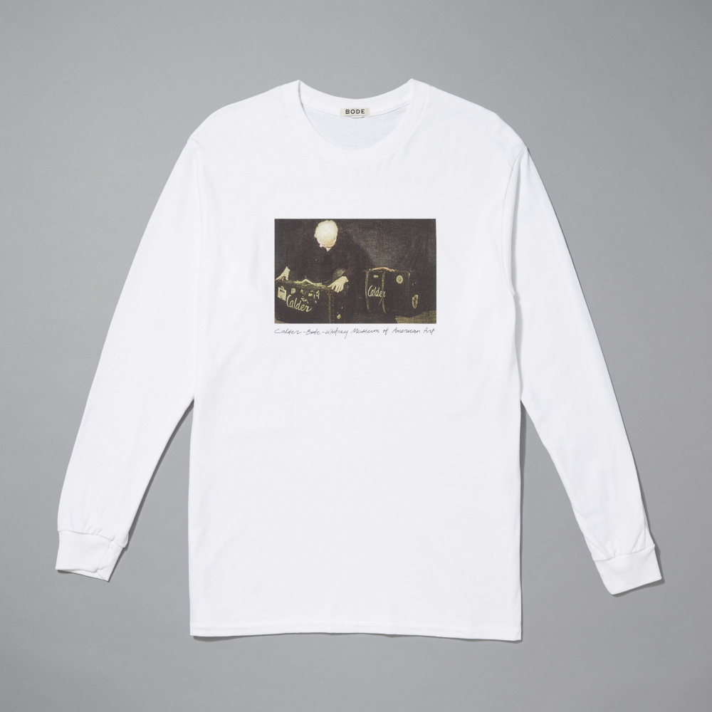 White long-sleeve shirt with a graphic design on a gray background
