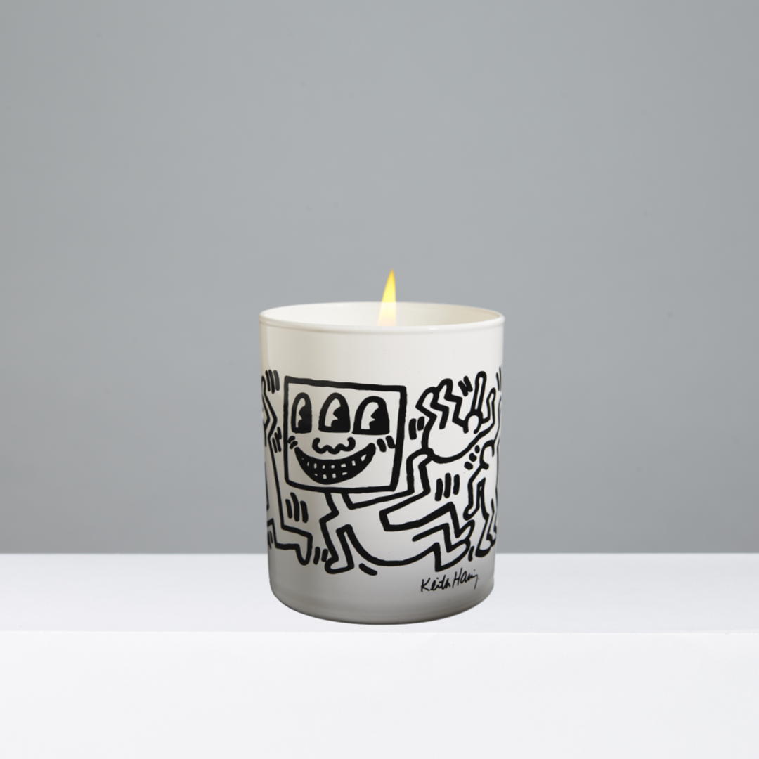 Candle with a black and white illustration on a gray background