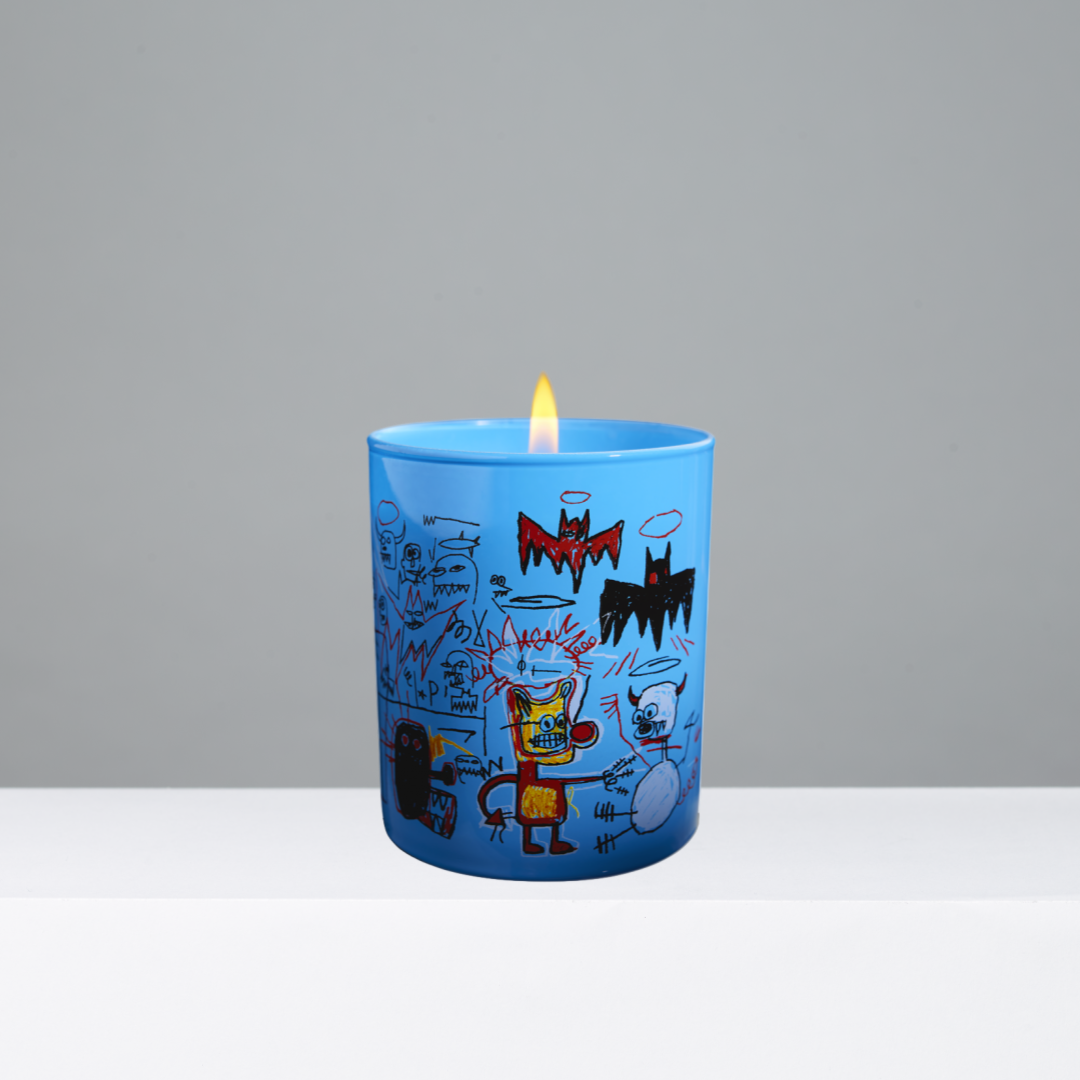 Blue candle with artistic design on a gray background