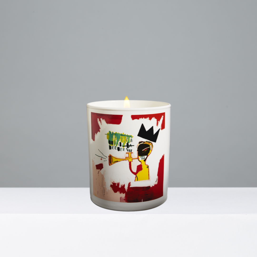 Candle with artistic design on a gray background