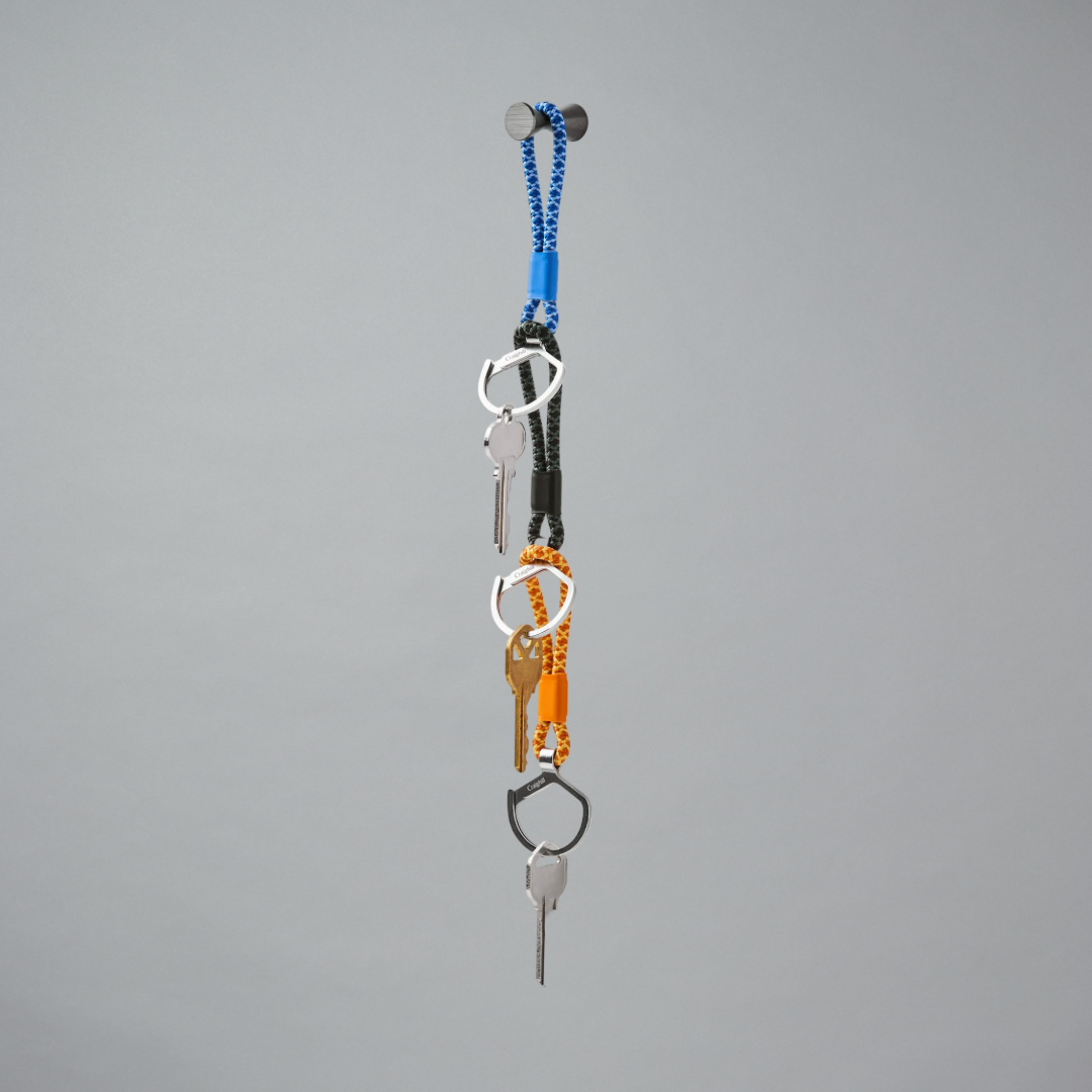 Keychains with multiple keys on a gray background