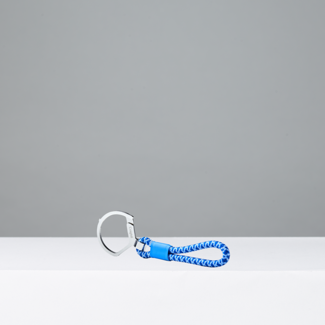 Keychain with blue rope and metal clip on a white background