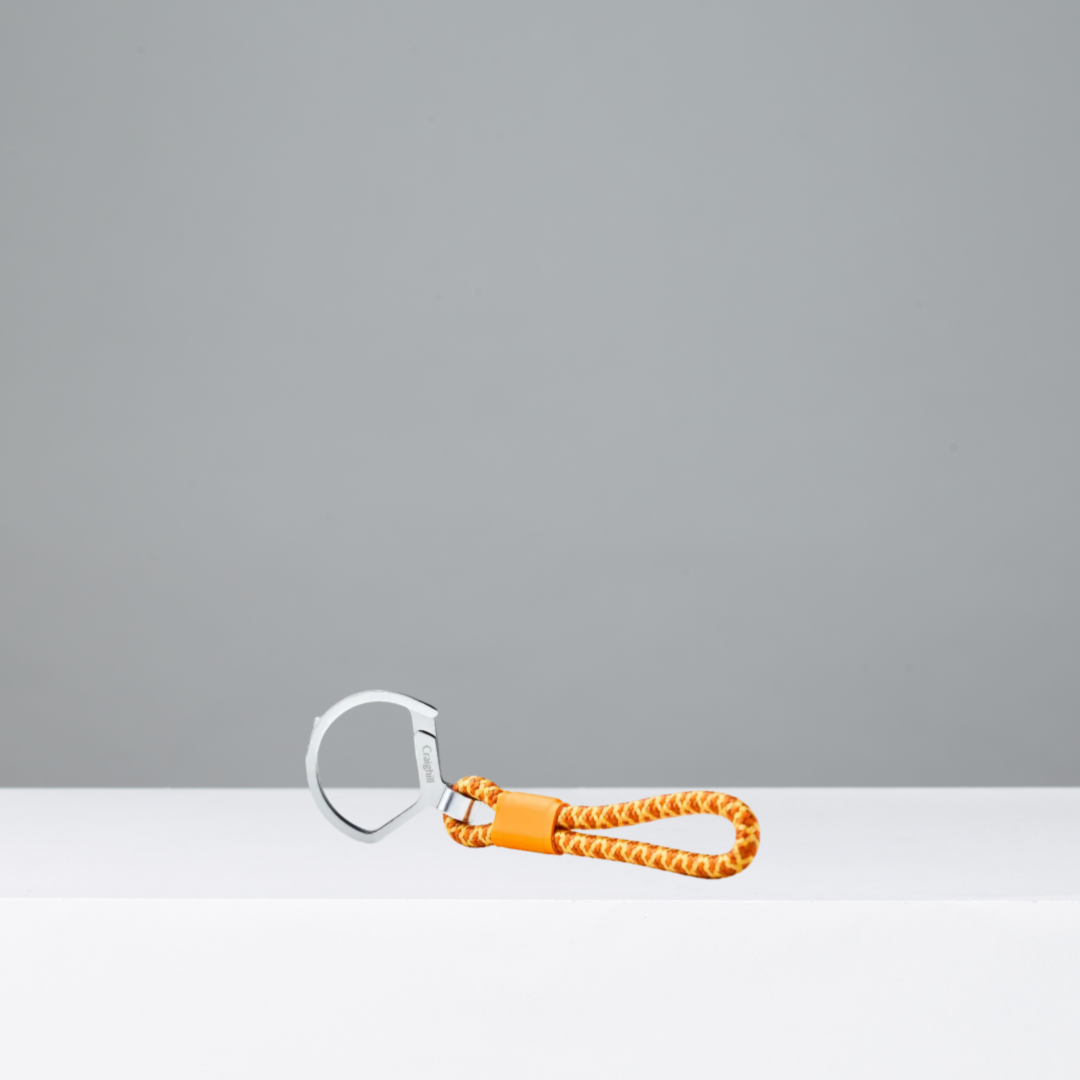 Keychain with orange rope and silver metal clip on a white background