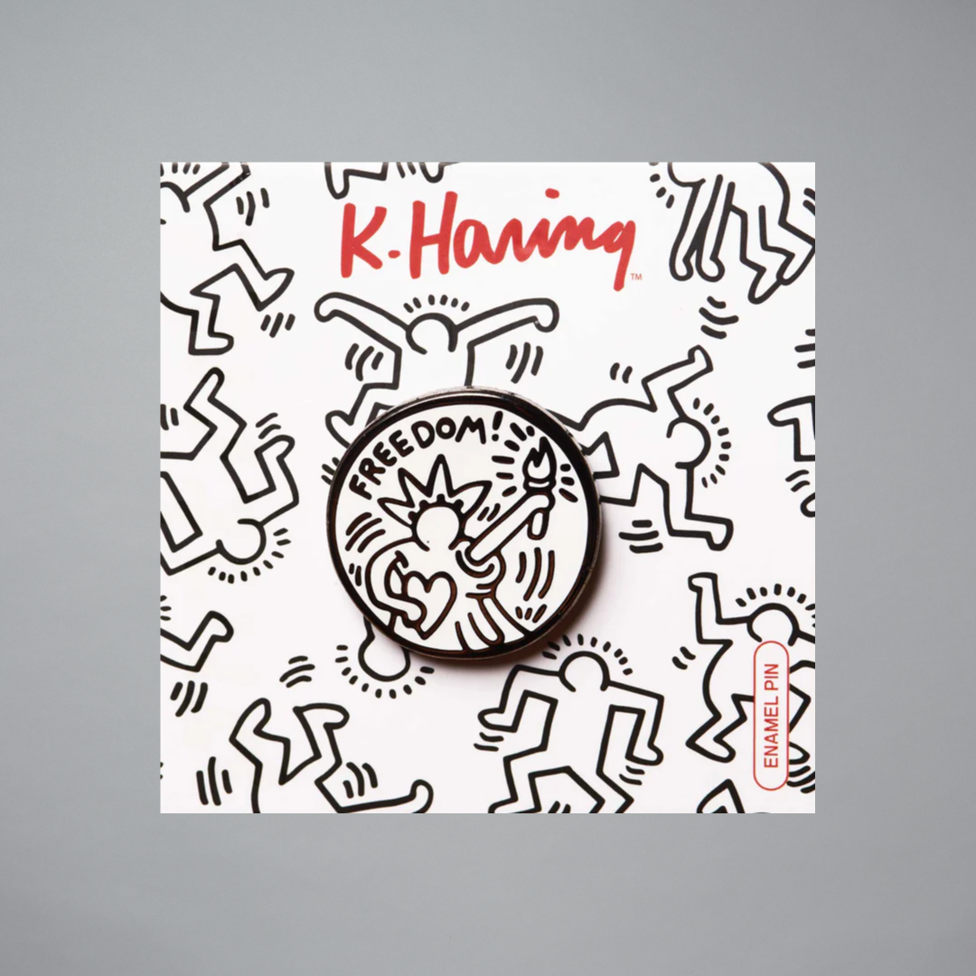 Keith Haring freedom pin on a gray background