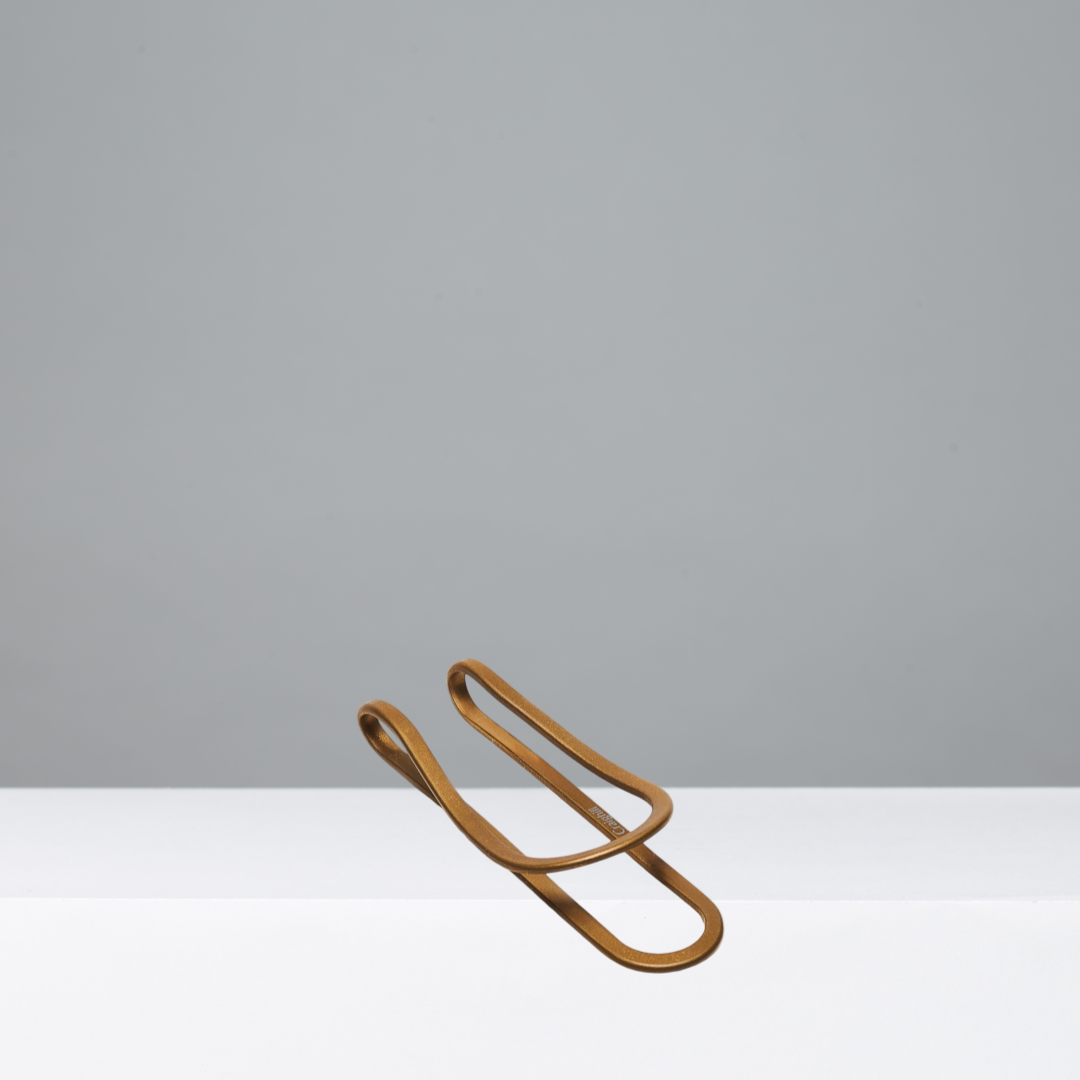 Gold money clip on a white background
