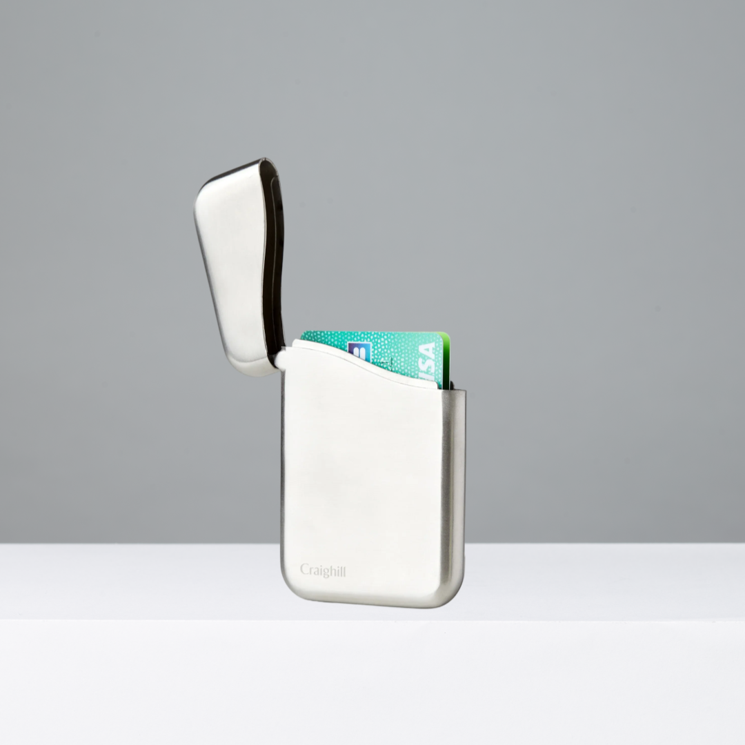 Stainless steel card case on a gray background