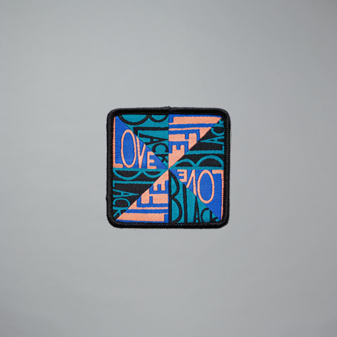 Woven patch featuring Faith Ringgold's Love Black Life