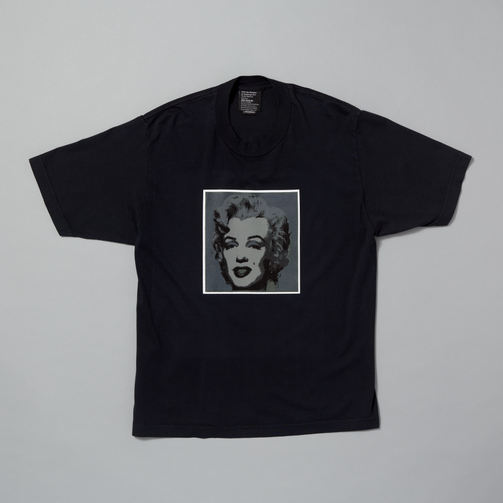 Black t-shirt featuring Andy Warhol's Marilyn on a gray background