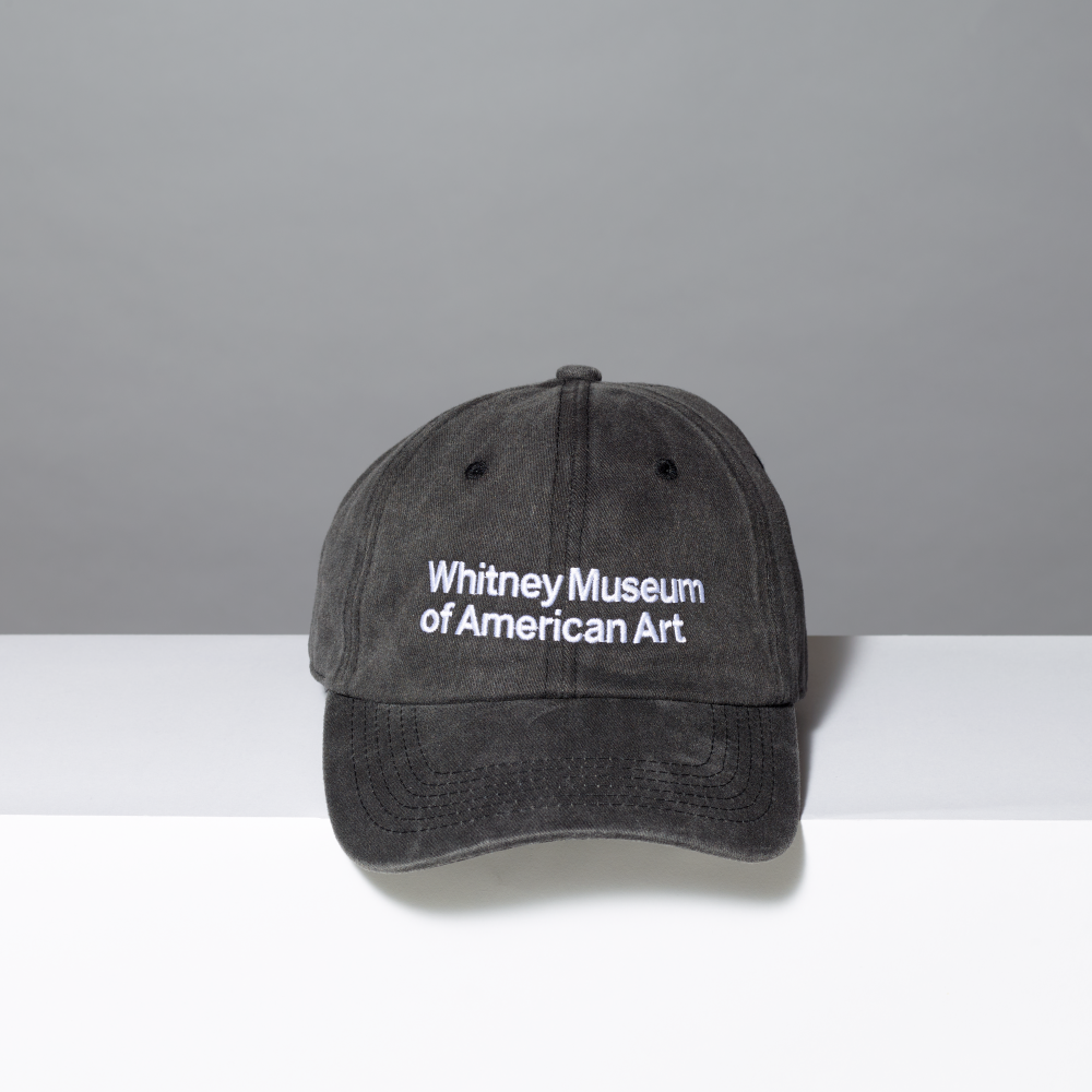 Acid wash black hat with Whitney Museum of American Art in white embroidery