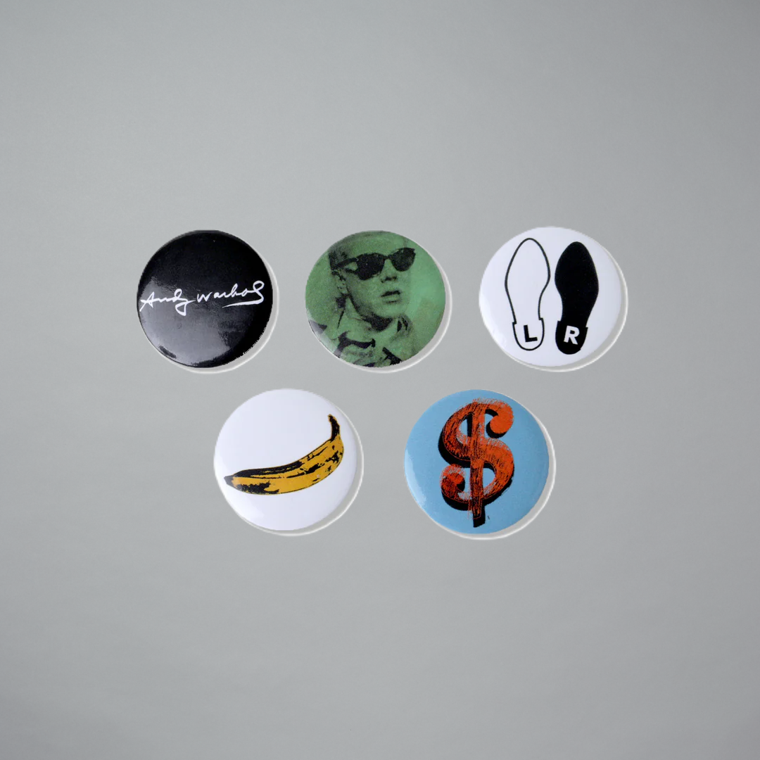 Set of five metal pins featuring works by Andy Warhol