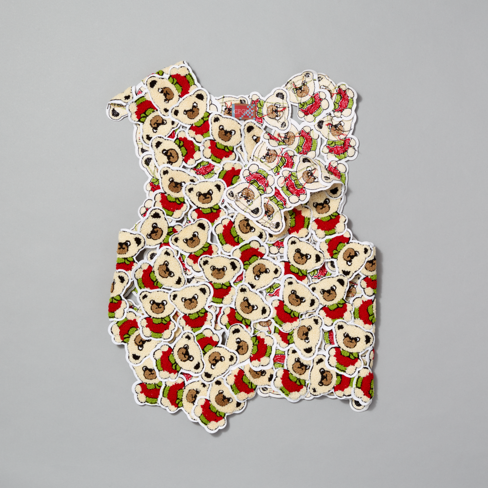 Vest featuring bear patches on a gray background