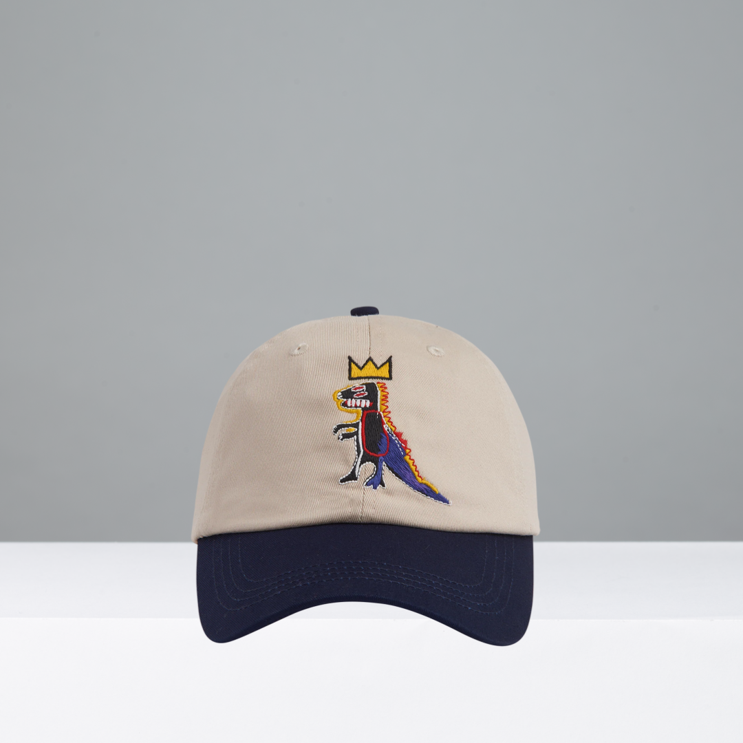 Beige and navy cap featuring Pez Dispenser by Jean-Michel Basquiat