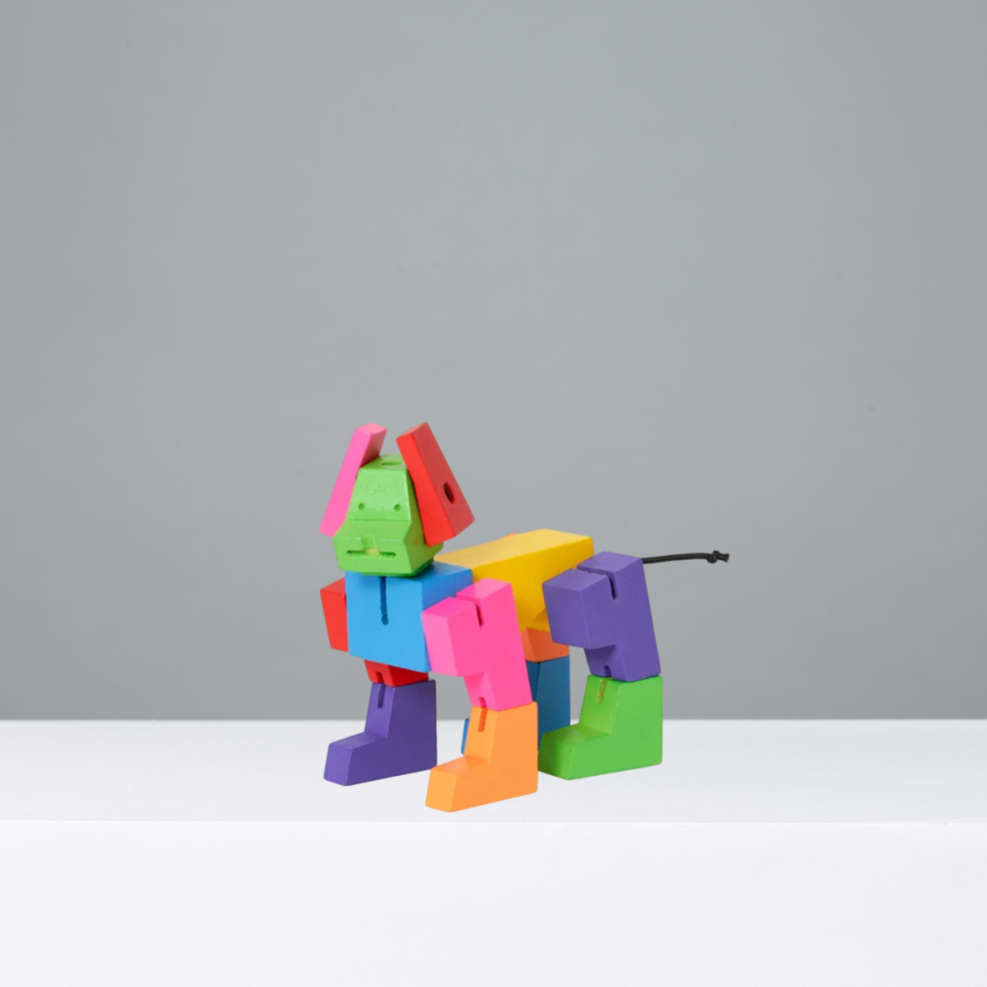 Colorful dog toy robot on a gray background