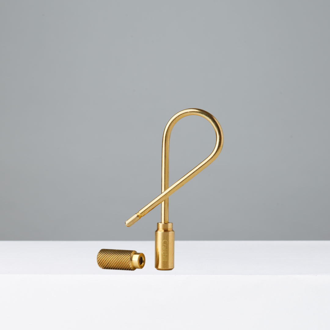 Brass Closed Helix Keyring on a gray background