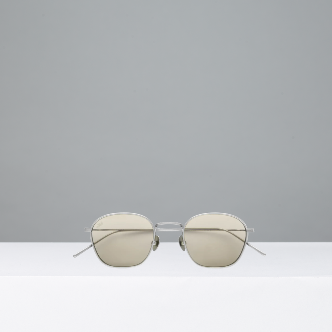 Sunglasses with reflective lenses on a gray background
