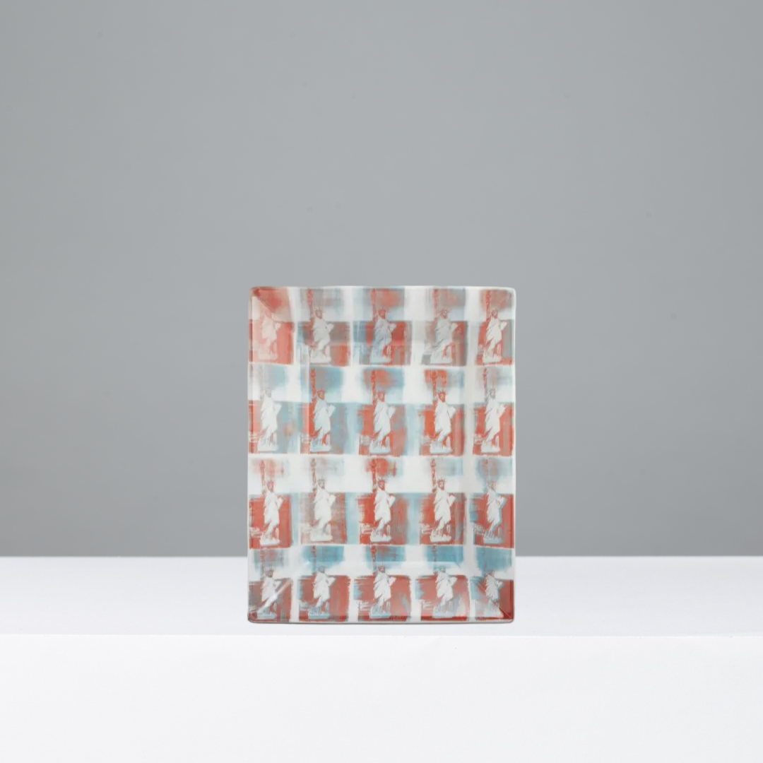 Porcelain tray featuring the artwork Statue of Liberty by Andy Warhol on a gray background
