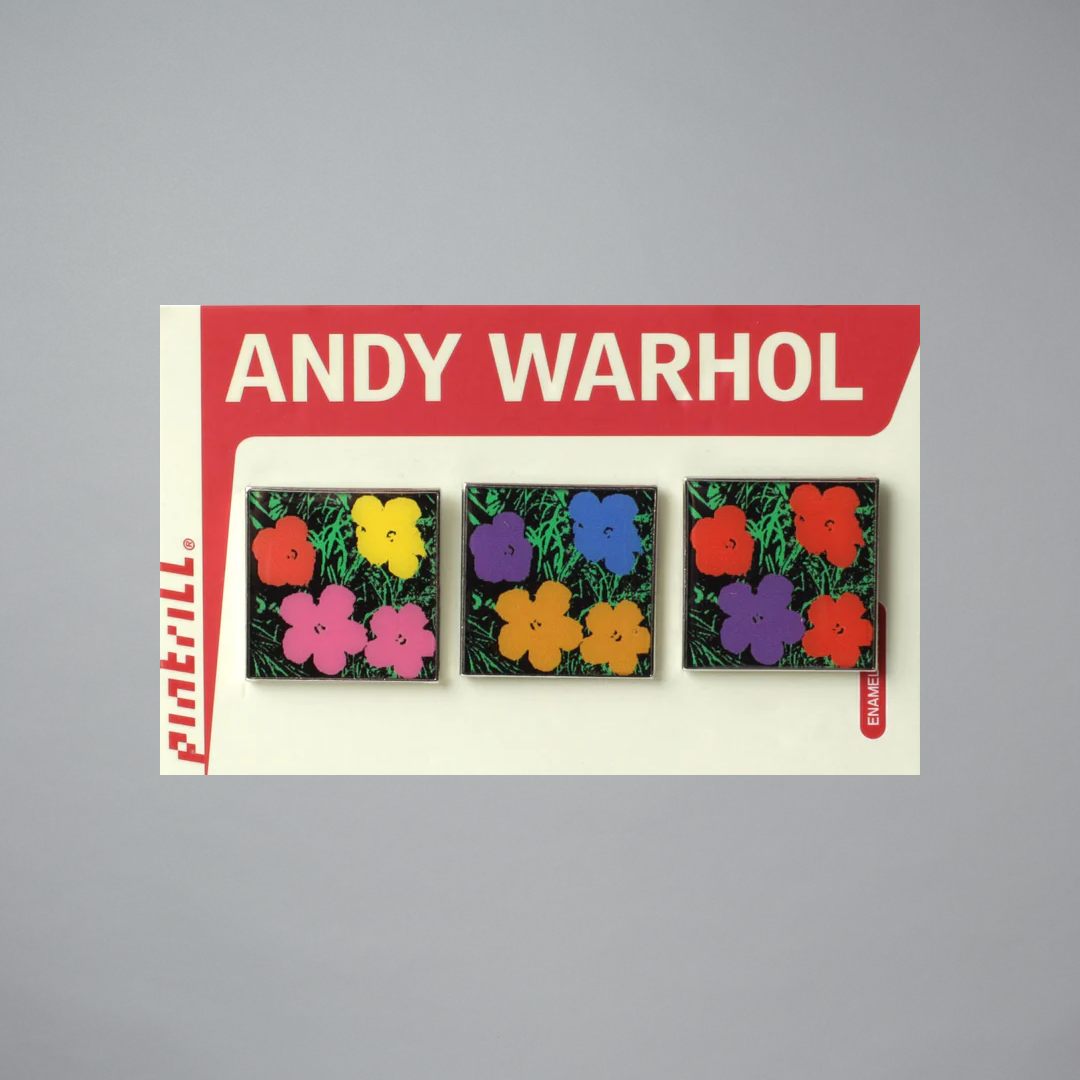 Andy Warhol floral pins with a red border on a gray background