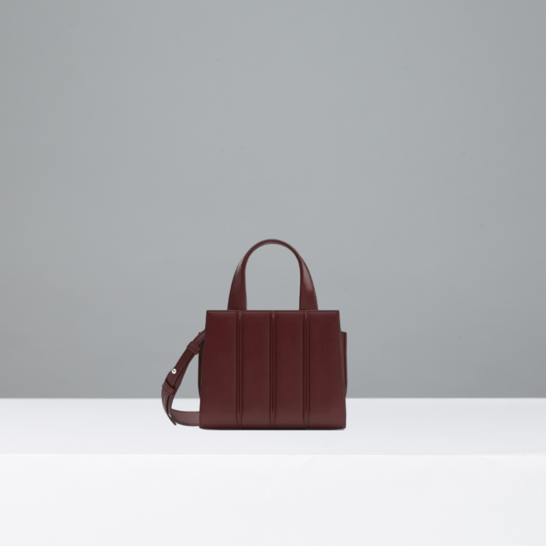 Red handbag on a gray background