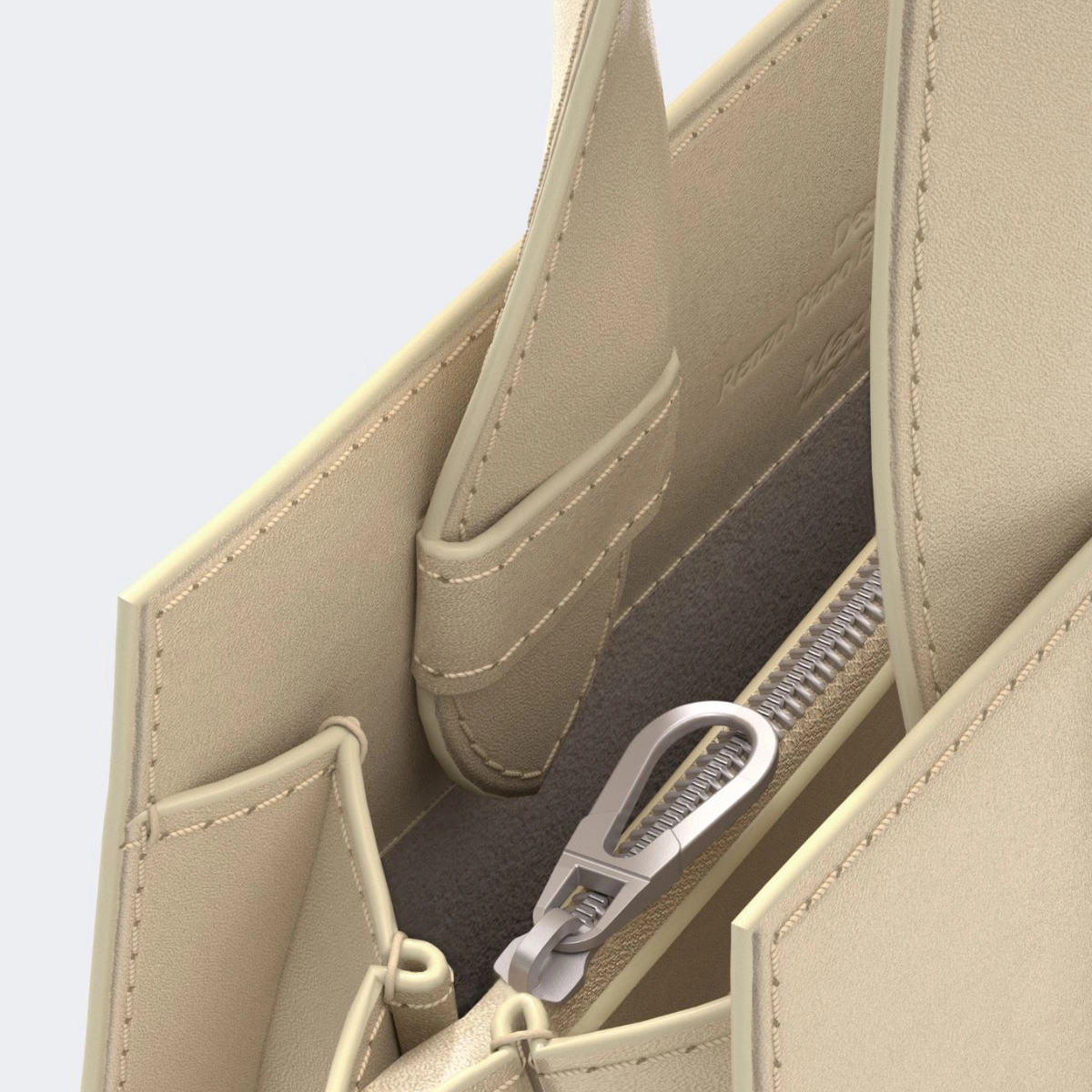 Close-up of a structured beige leather handbag showing the interior zippered compartment with a silver zipper pull.