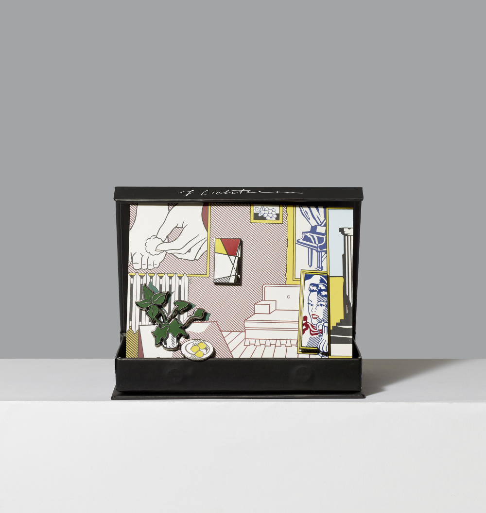 Enamel pin set featuring Artist's Studio, Foot Medication by Roy Lichtenstein in a black gift box on a white ledge