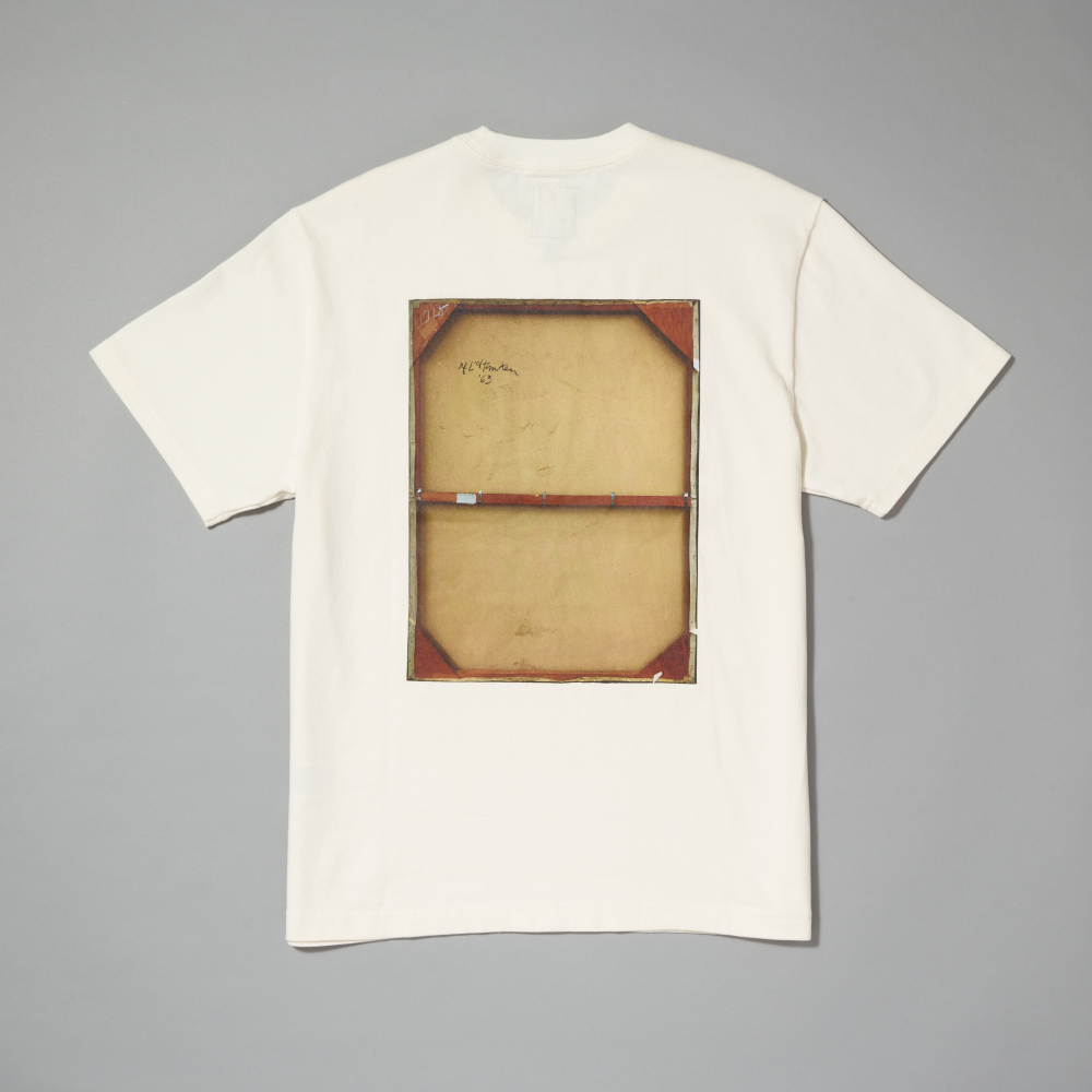 An off-white short-sleeve t-shirt laid flat on a neutral gray background, featuring a large graphic print of the back of Roy Lichtenstein's work Girl in Window