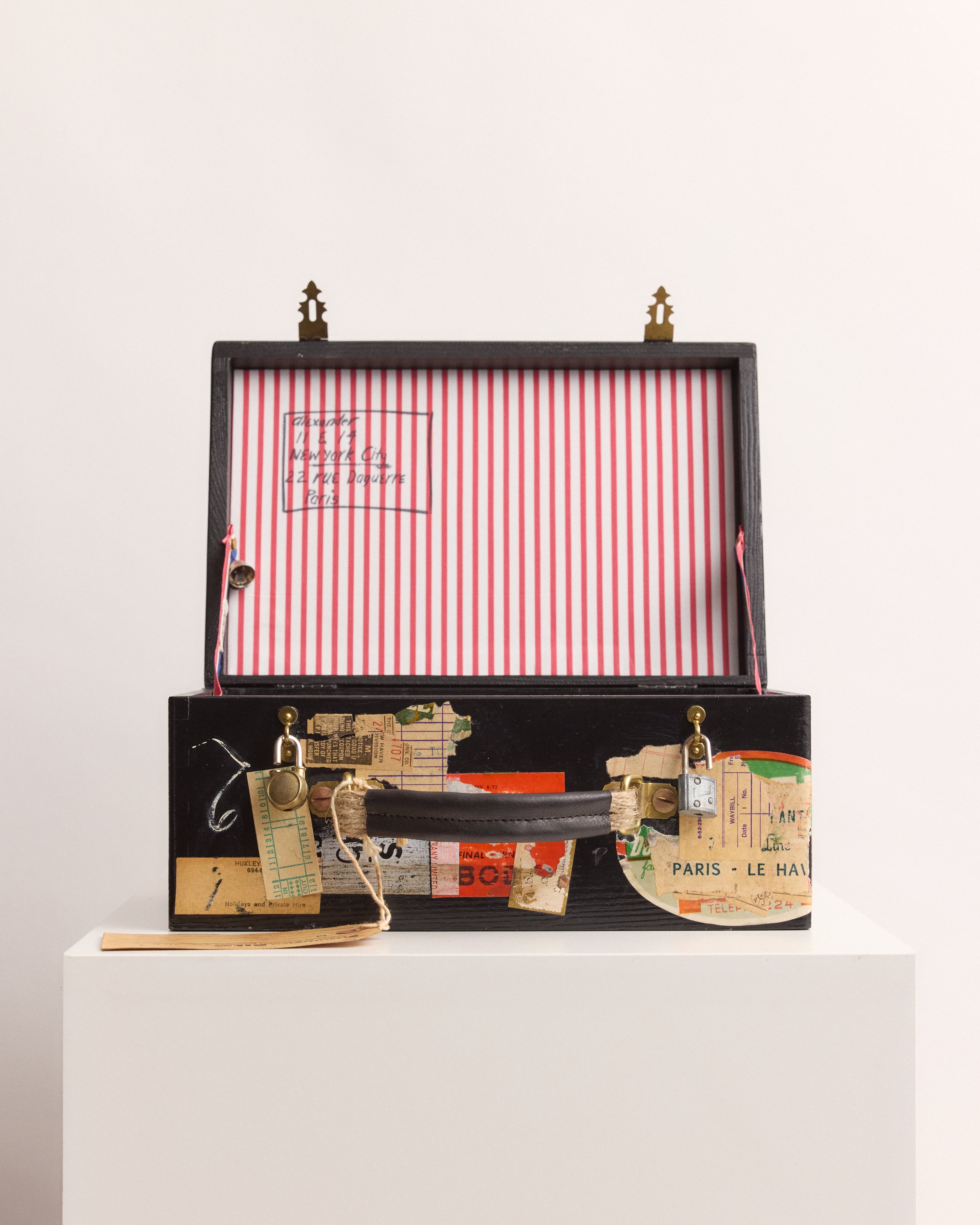 Decorative box with striped interior on a white background