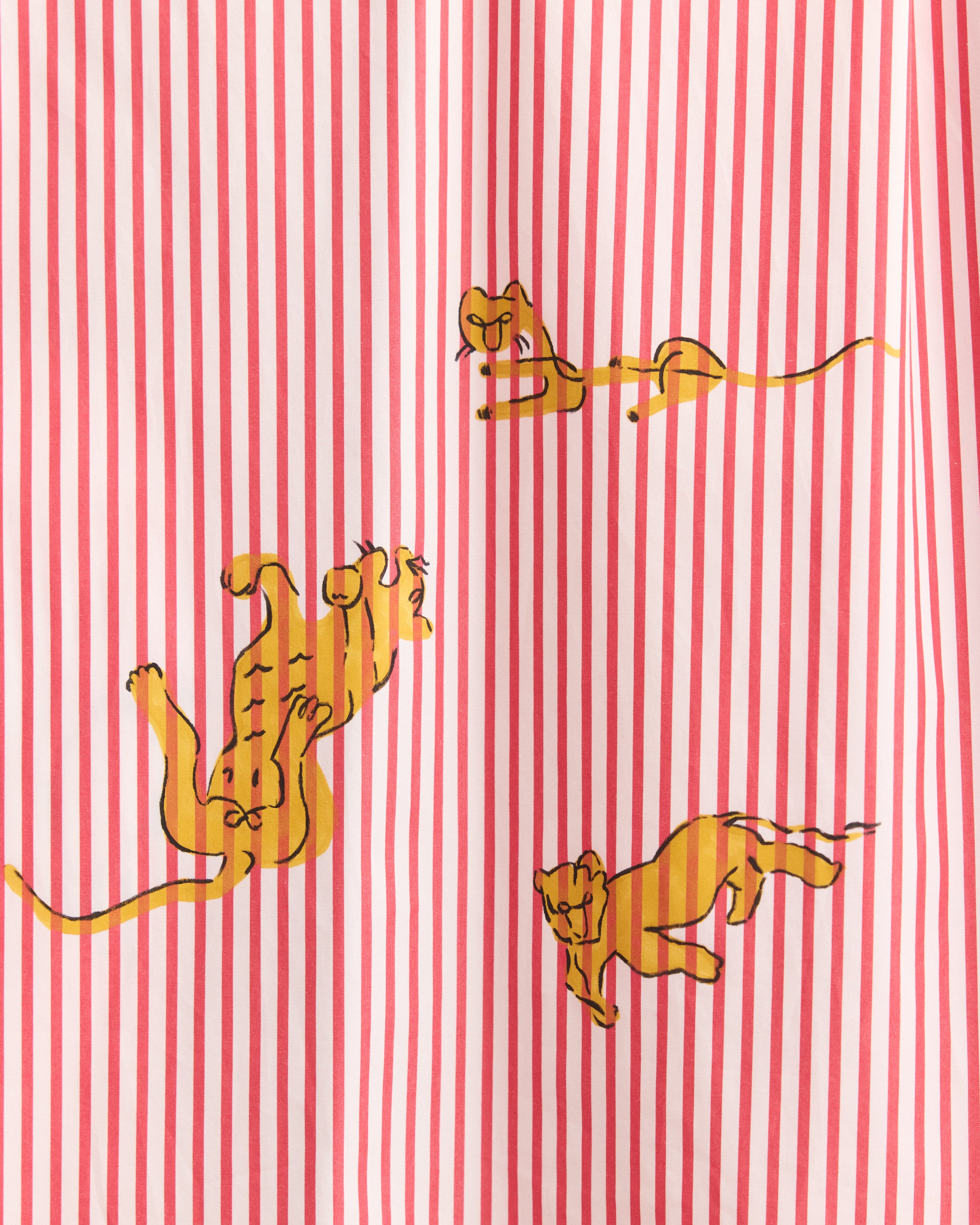 Red and white striped fabric with orange tiger illustrations